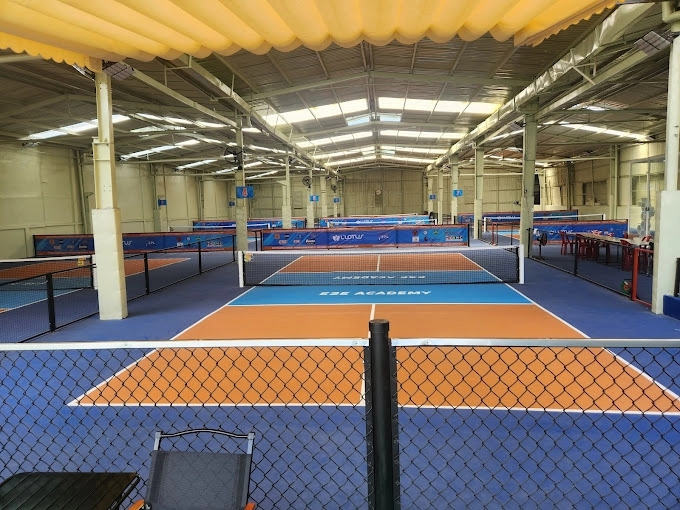 Indoor courts at Hyprground in Petaling Jaya featuring VIP lounges and view of playing area within the converted warehouse space.