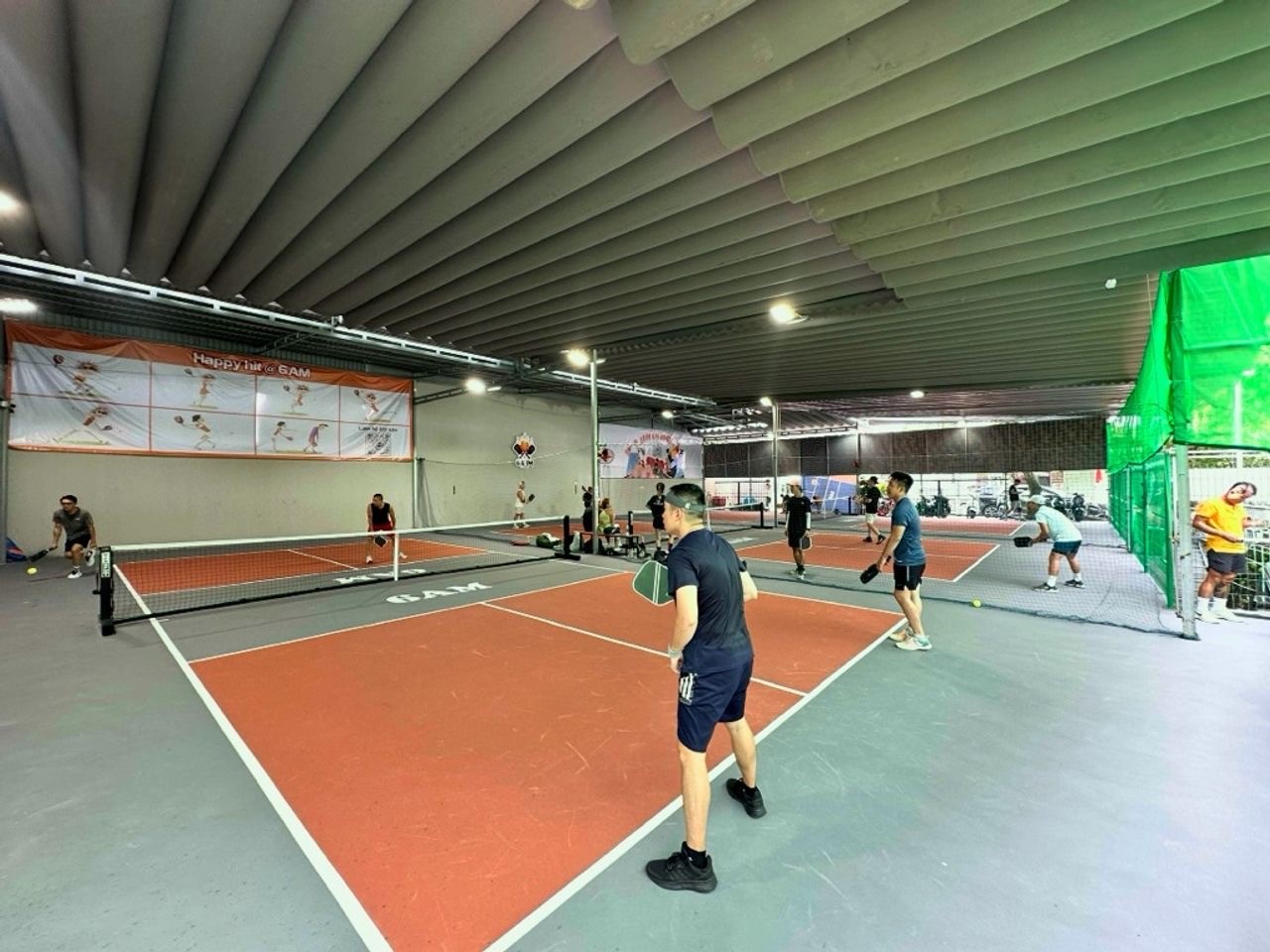 Indoor courts at Hyprground in Petaling Jaya featuring VIP lounges and view of playing area within the converted warehouse space.