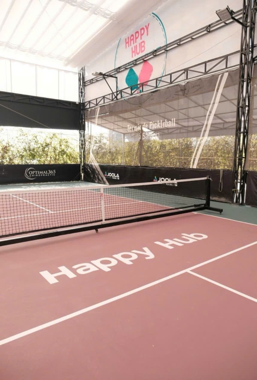 Indoor courts at Hyprground in Petaling Jaya featuring VIP lounges and view of playing area within the converted warehouse space.