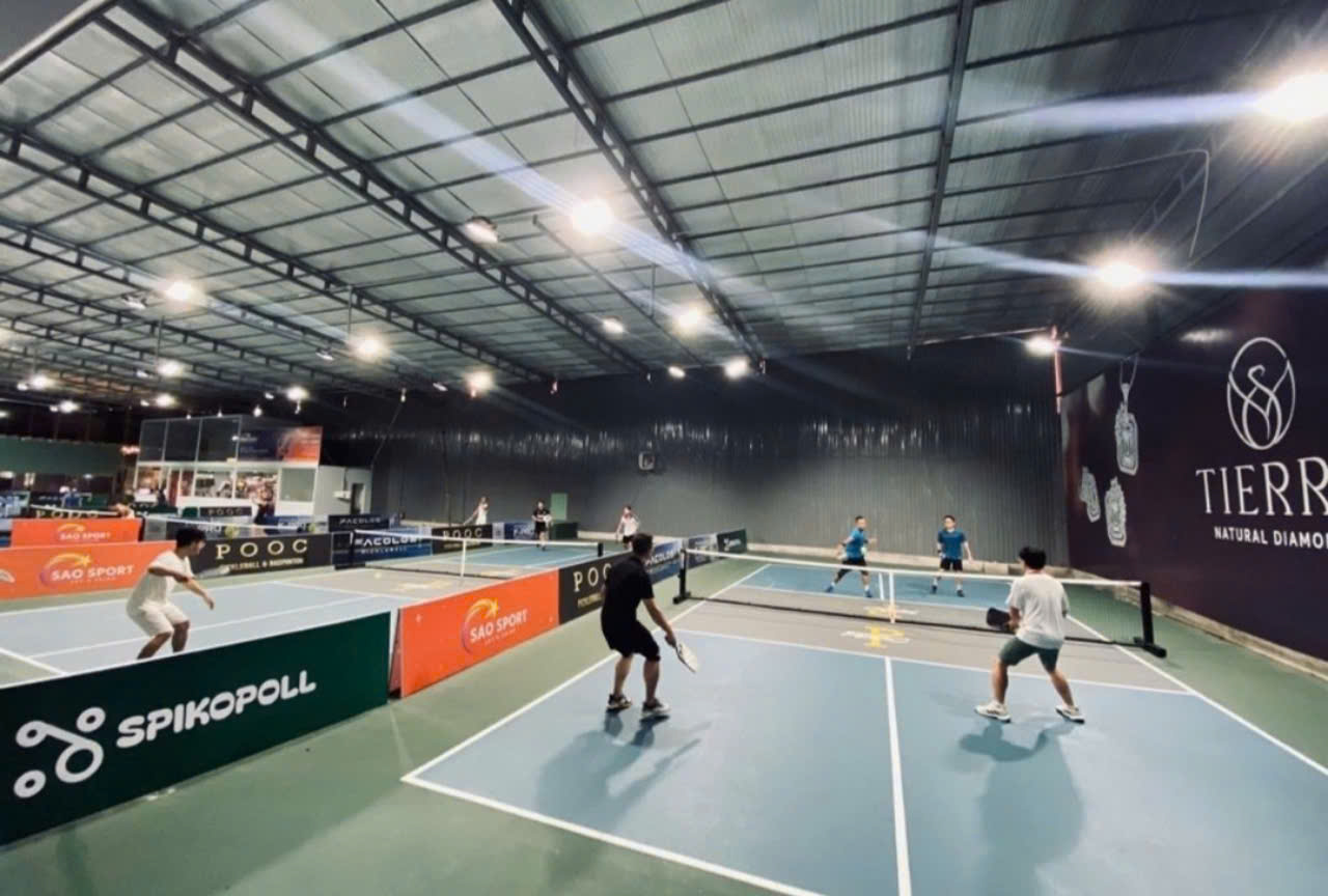 Indoor courts at Hyprground in Petaling Jaya featuring VIP lounges and view of playing area within the converted warehouse space.