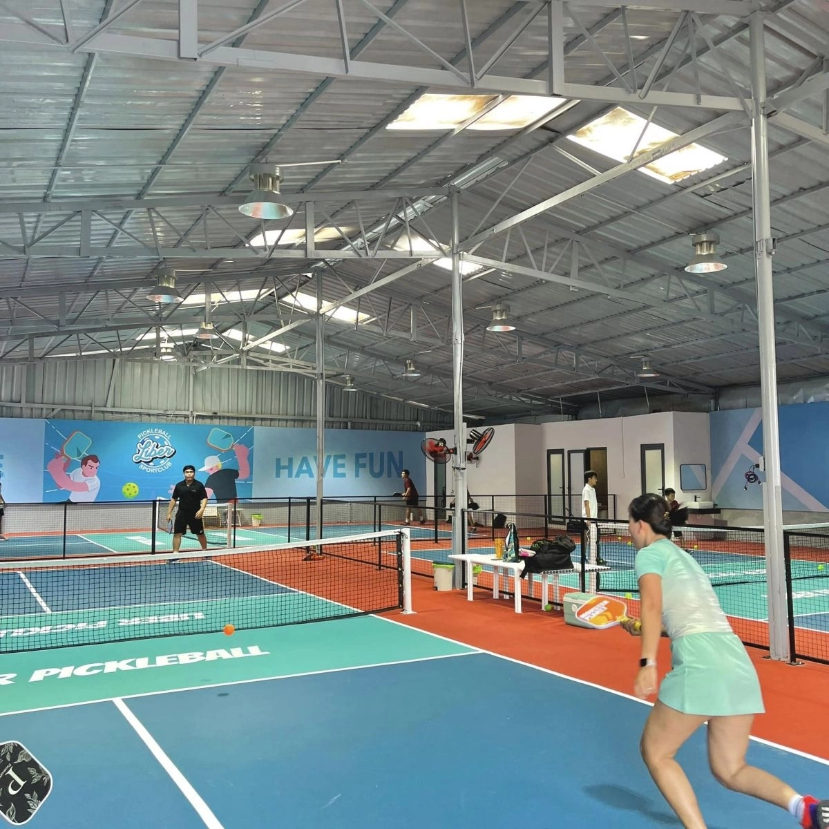 Indoor courts at Hyprground in Petaling Jaya featuring VIP lounges and view of playing area within the converted warehouse space.