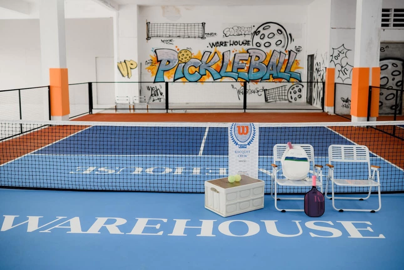 Indoor courts at Hyprground in Petaling Jaya featuring VIP lounges and view of playing area within the converted warehouse space.