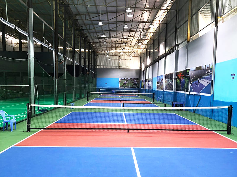 Indoor courts at Hyprground in Petaling Jaya featuring VIP lounges and view of playing area within the converted warehouse space.