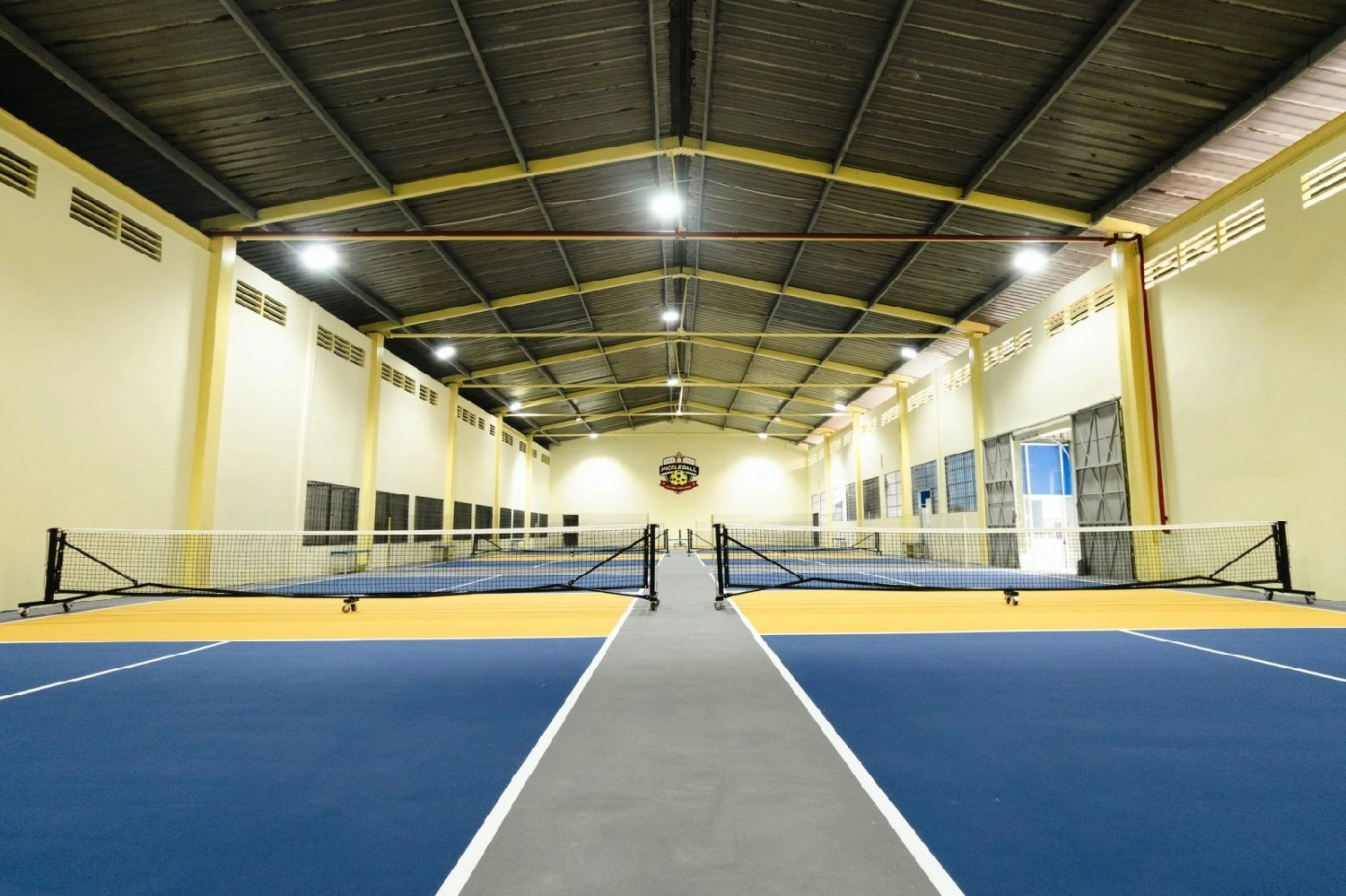 Indoor courts at Hyprground in Petaling Jaya featuring VIP lounges and view of playing area within the converted warehouse space.