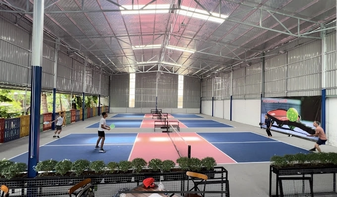 Indoor courts at Hyprground in Petaling Jaya featuring VIP lounges and view of playing area within the converted warehouse space.